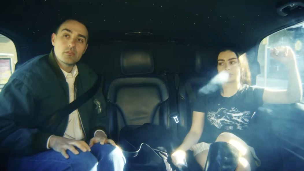 Jamie Demetriou and Charli XCX in 'The Moment'